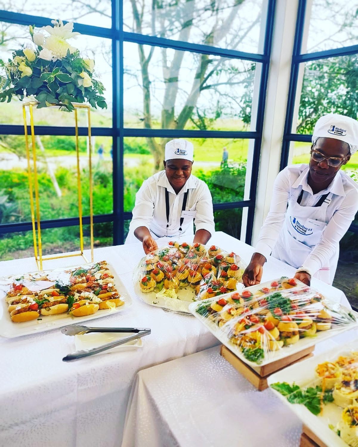 Staff plating canapés on-site