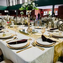 Full gold and white table setting in a hall